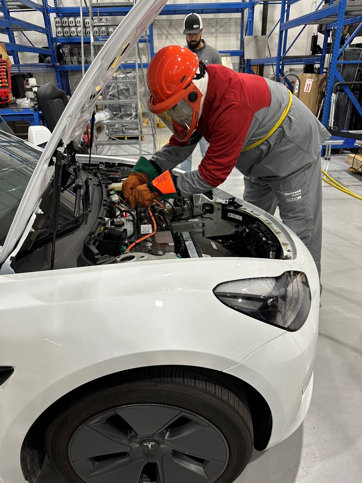 Technician working on an electric vehicle